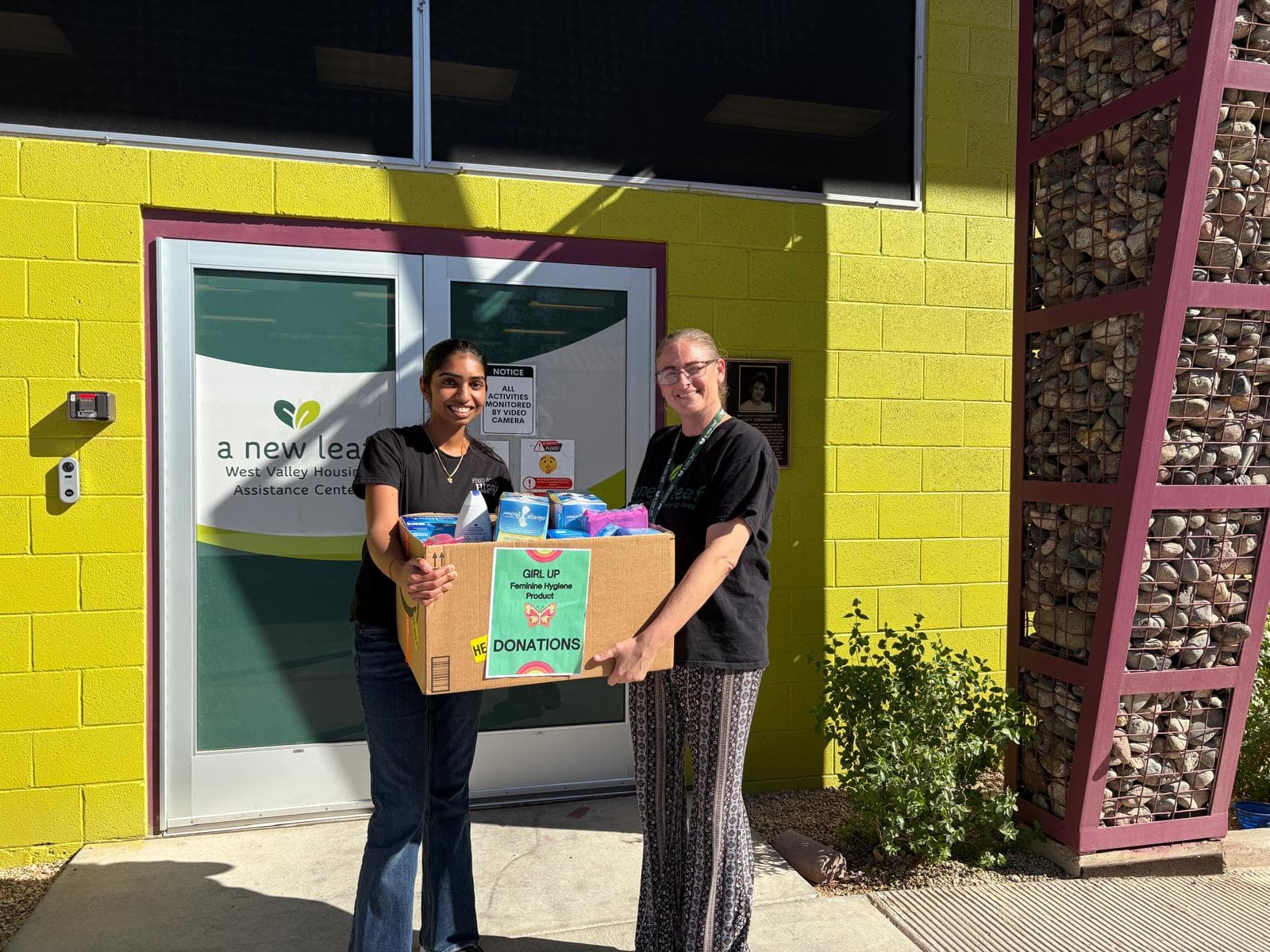 Volunteers organizing donated supplies for community distribution